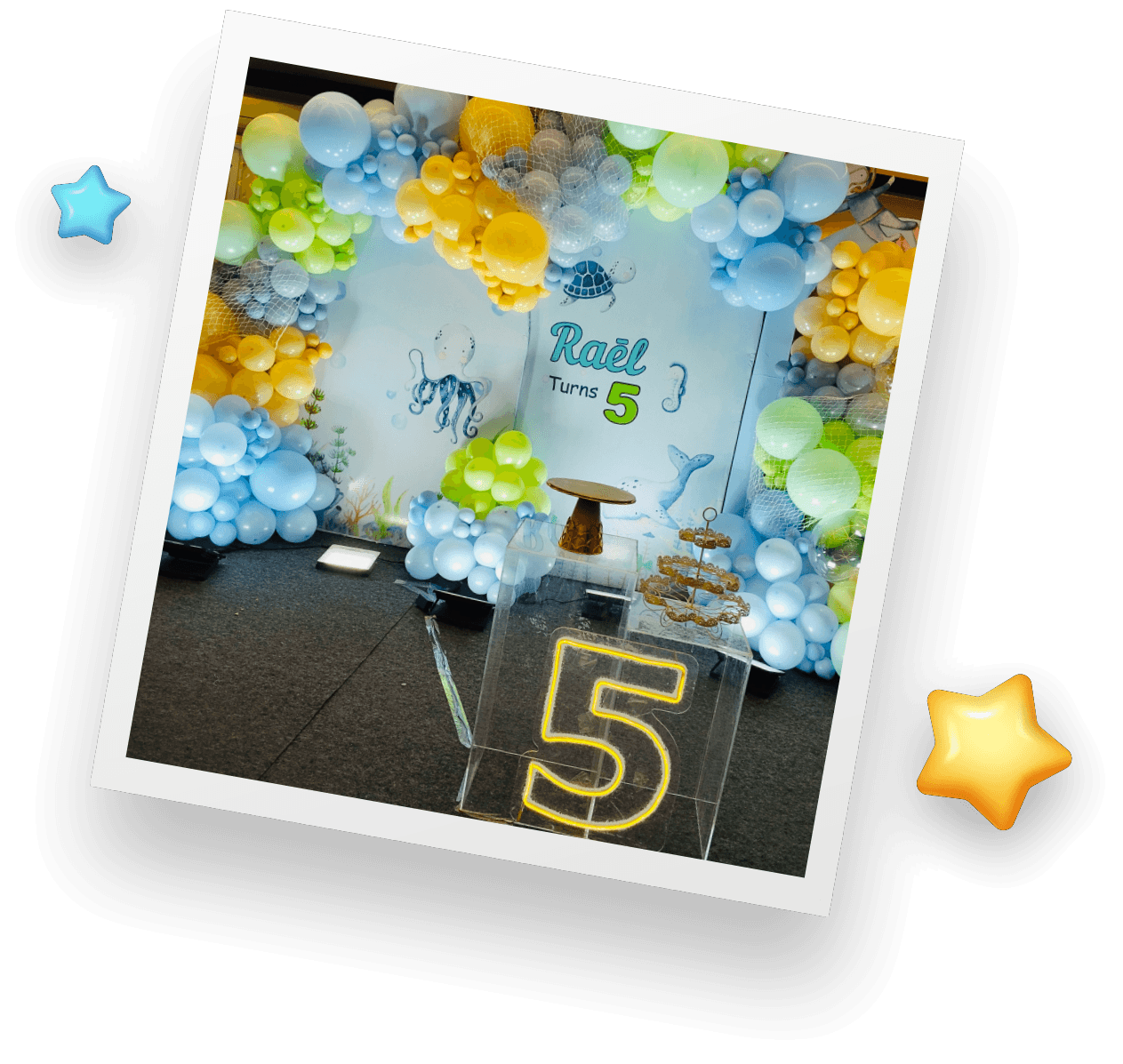 Kids birthday decoration with balloons and cake setup